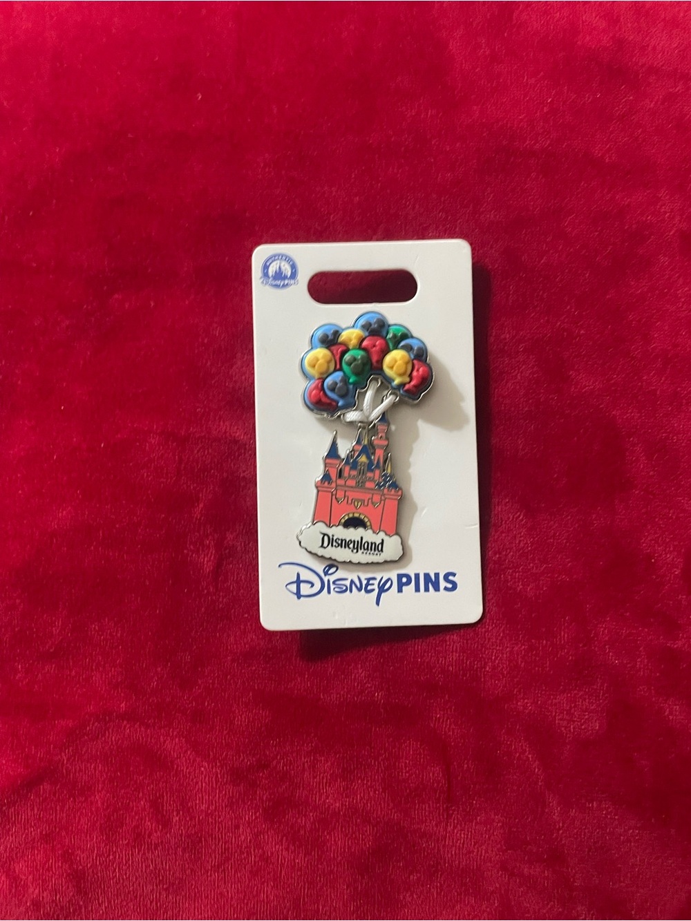 Disney pin on card